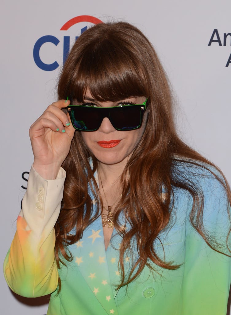 Jenny Lewis peeked out from behind her mirror-effect lenses on the Grammys red carpet.