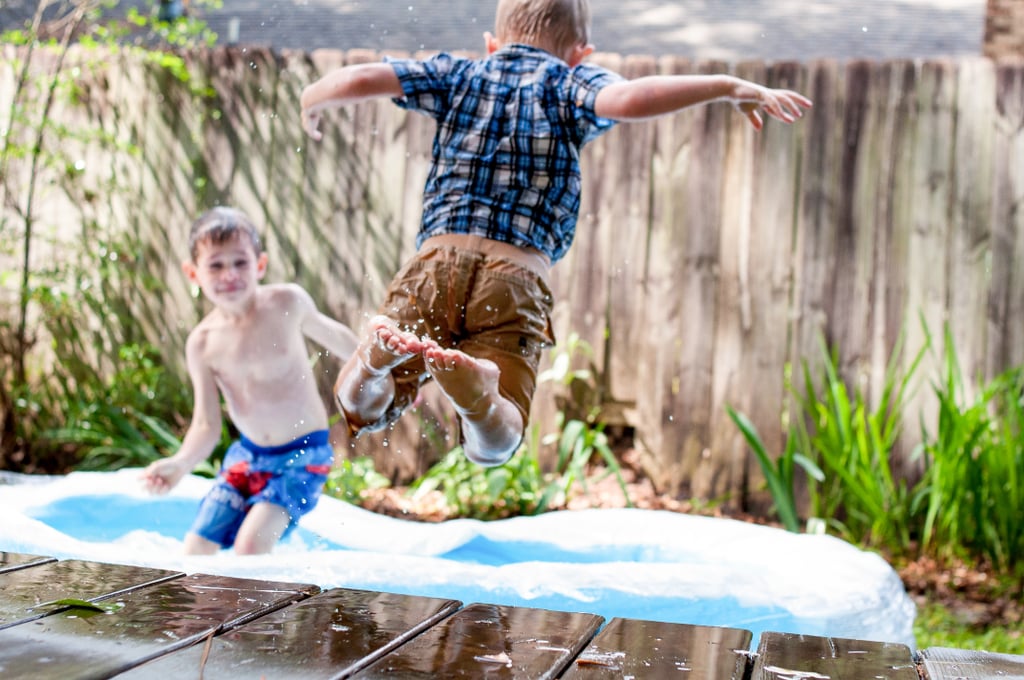 Empty the toddler pool efficiently with a length of hose.