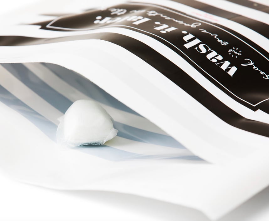 The bags are recyclable and contain hypoallergenic soaking pods. The clothing will presoak until you get home and can toss it into the machine.