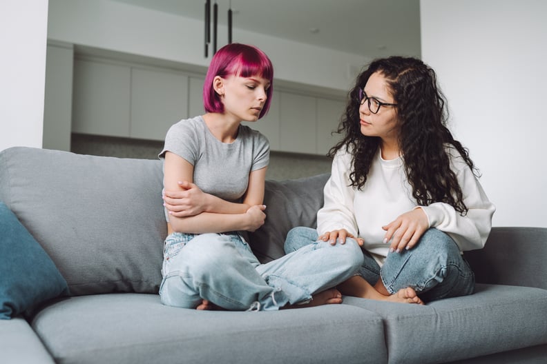 Mom and daughter talking on couch