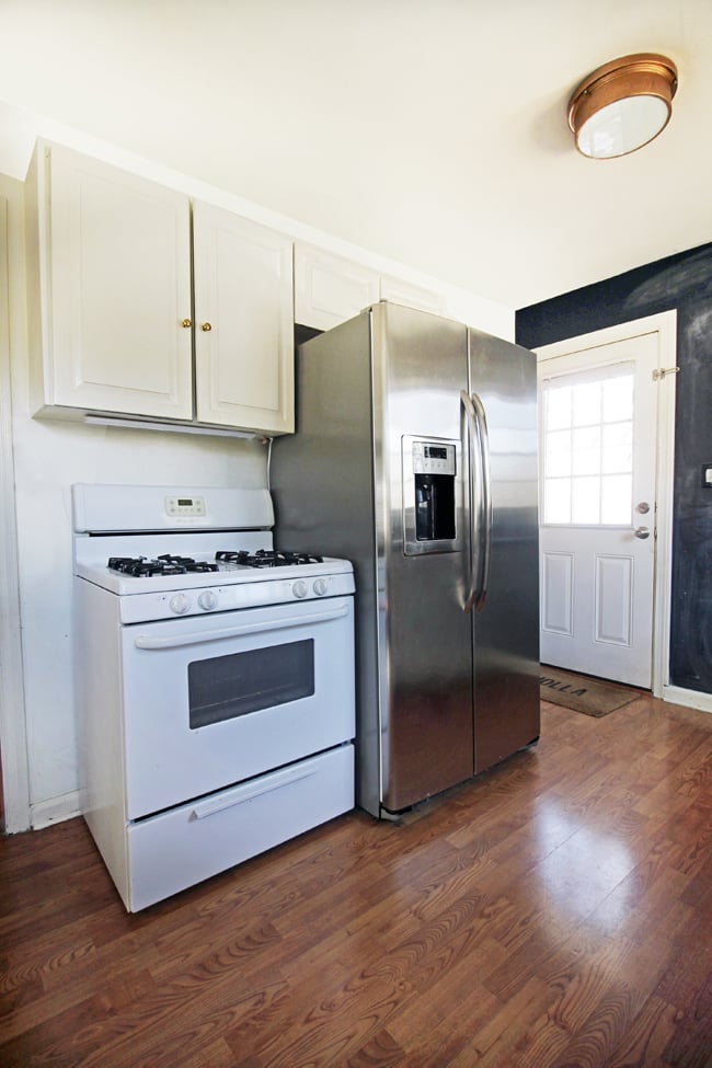 Before the makeover, Kristin's refrigerator was toward the back of the kitchen.