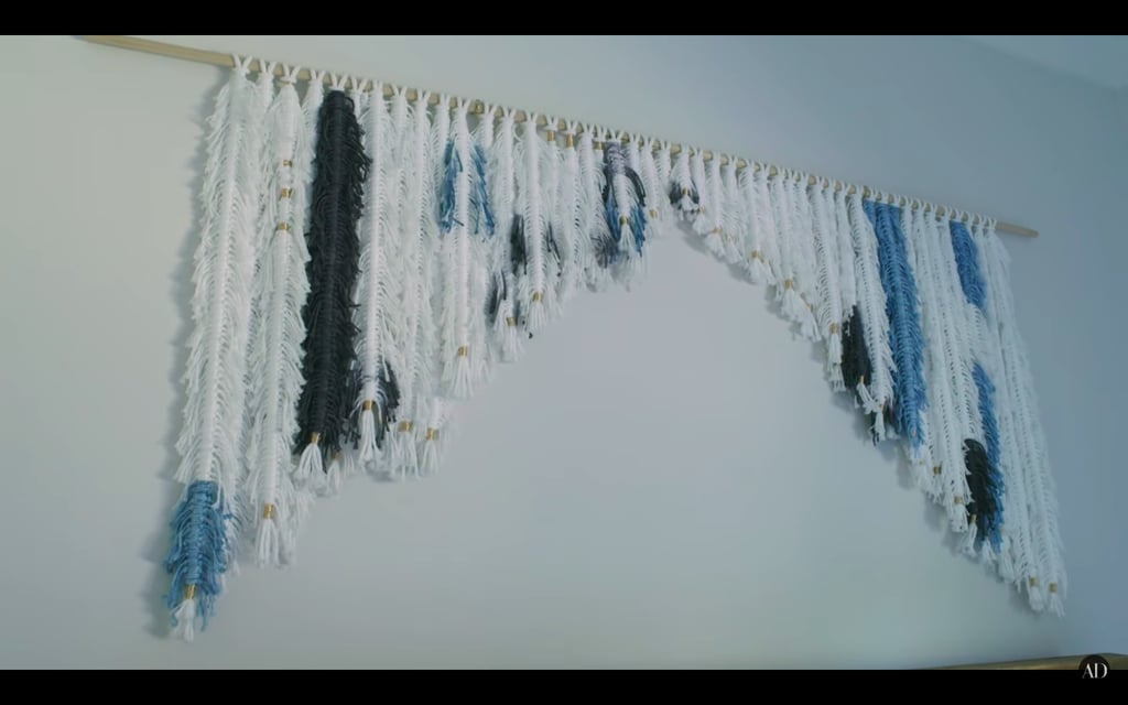 Emmy made the macrame hanging over the bed in their second guest bedroom.