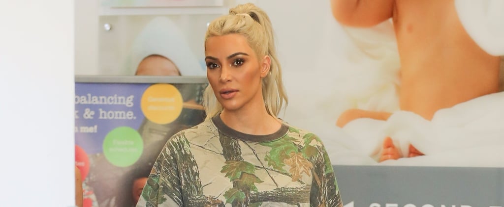 Kim Kardashian Beige Lace-Up Boots and Sweat Shorts