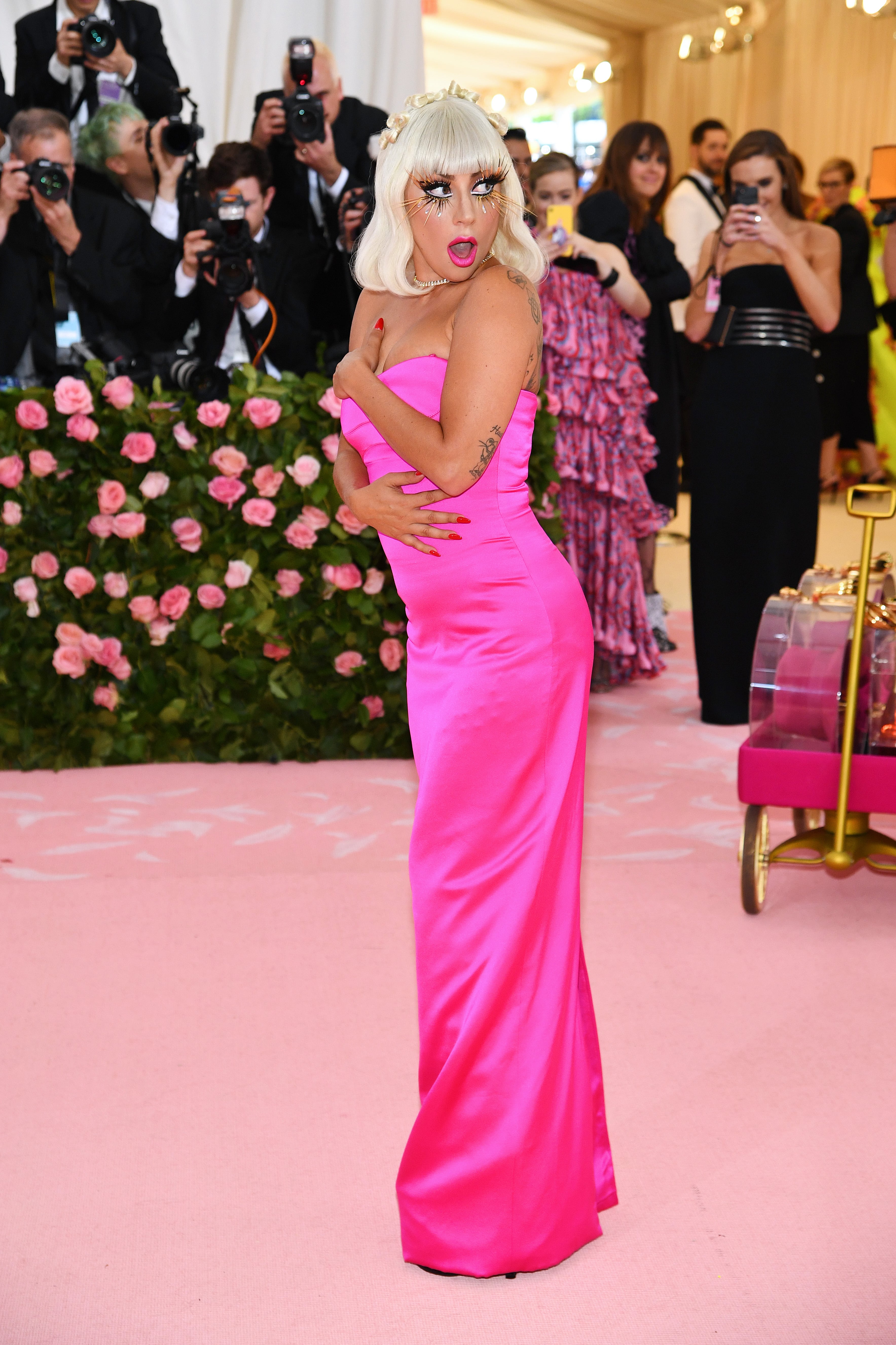 lady gaga pink dress Met Gala 2019: Watch Lady Gaga's Four Outfit Changes on Red Carpet