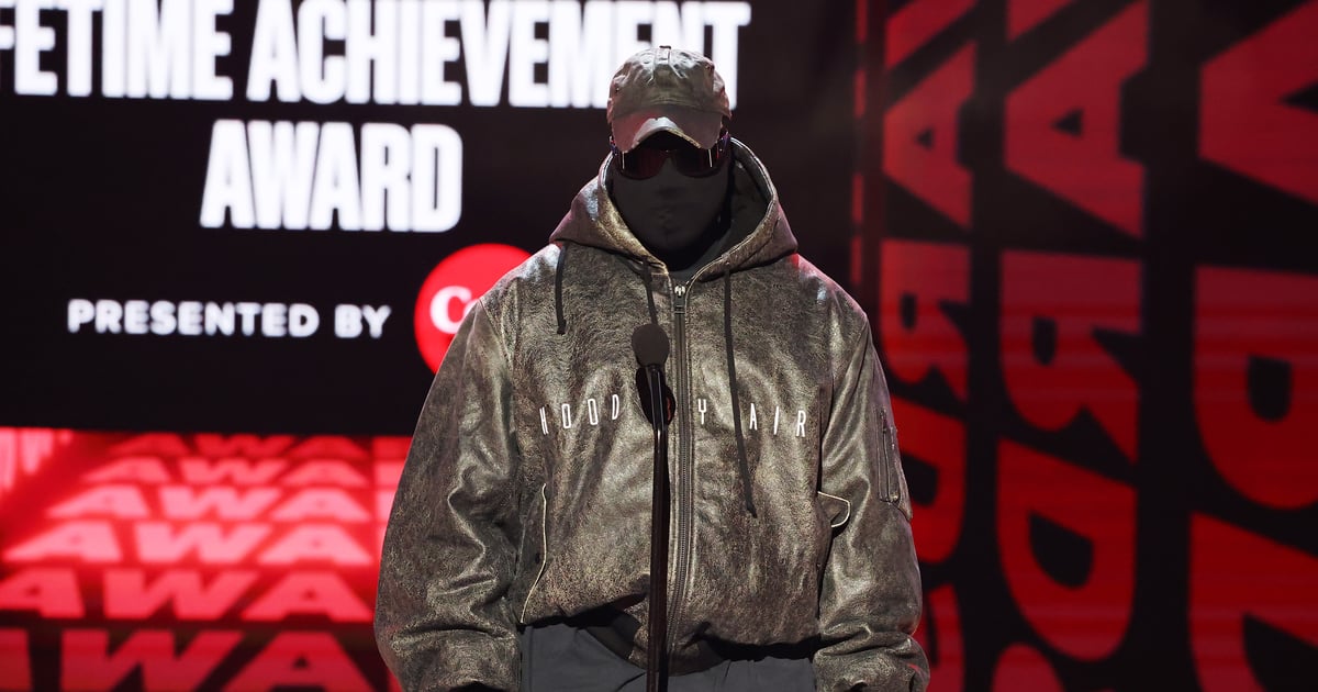 See Kanye West’s Masked Outfit at the 2022 Guess Awards