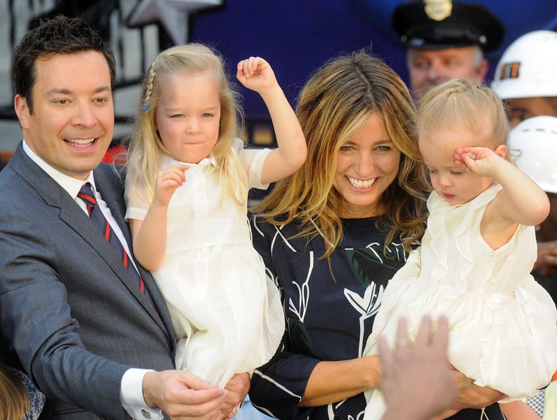 ORLANDO, FL - APRIL 06:  Jimmy Fallon (r), his wife Nancy Juvonen and daugthers Winnie and Frances greet the audience during the Grand Opening of Universal Orlando's Newest Attraction 