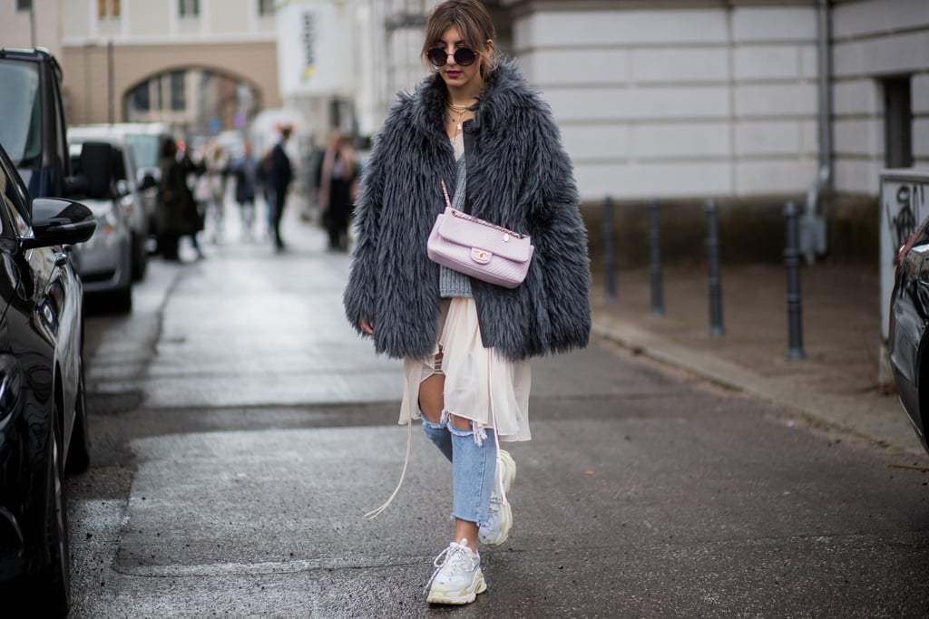 With a Furry Coat and Distressed Denim