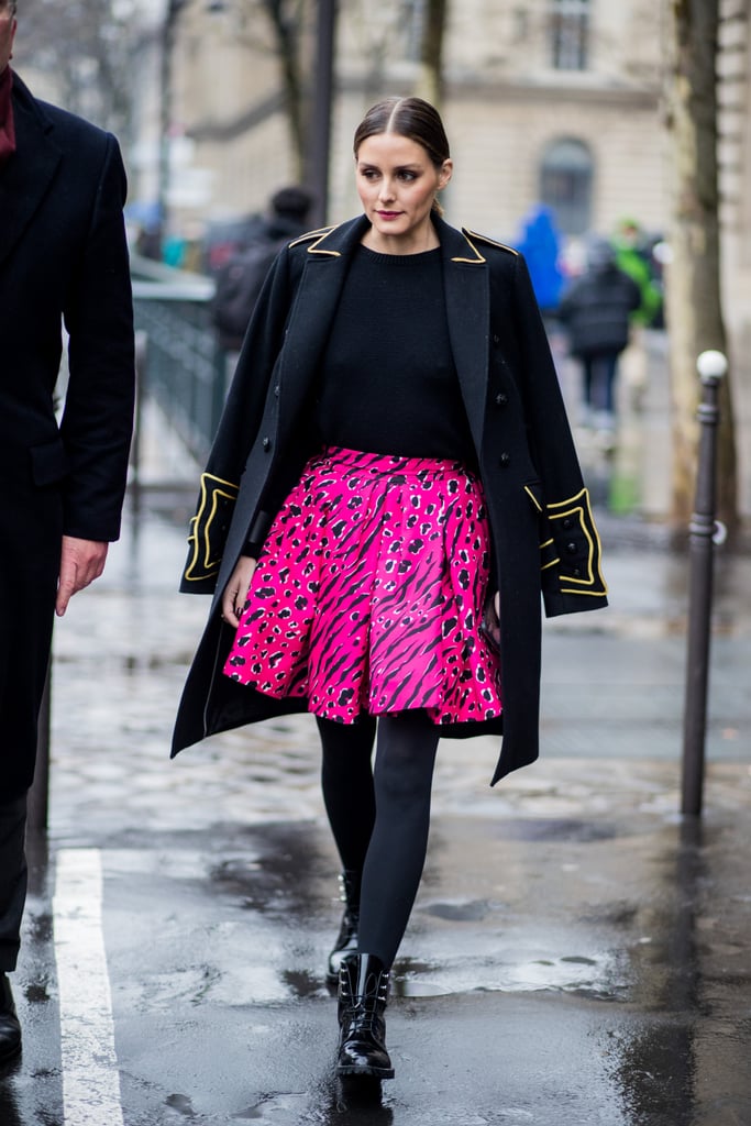 Olivia walked the streets of Paris in a bright patterned pink skirt outside the Balmain show.
