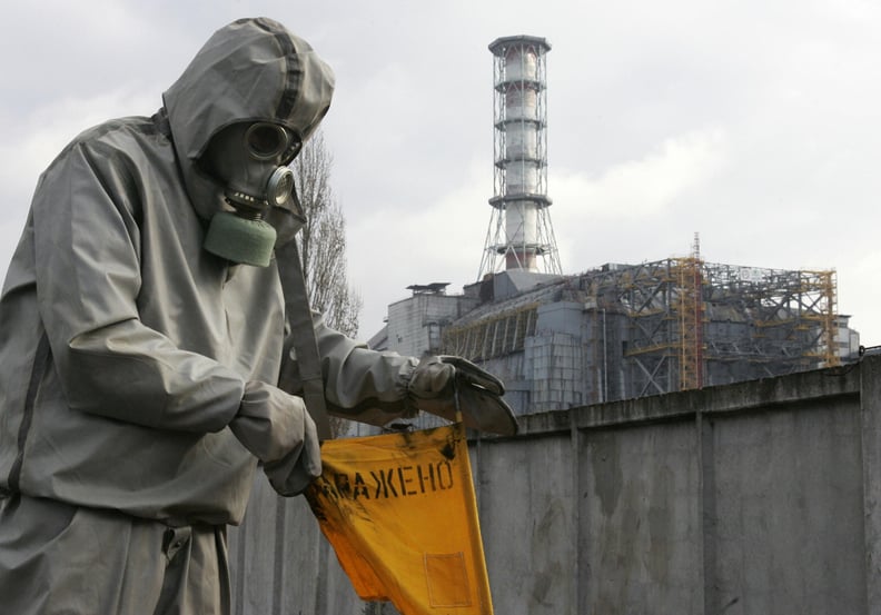 Chernobyl, UKRAINE:  A rescue worker sets flag signalling radioactivity in front of Chernobyl nuclear power plant during a drill organized by Ukraine's Emergency Ministry 08 November 2006. Employees and rescue workers improved their reactivity in case of 