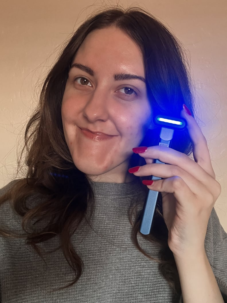 woman holding Solawave Blue Light Therapy Wand