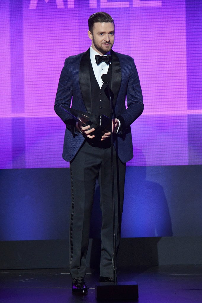 To accept his honors at this year's American Music Awards, Timberlake ditched class black for a navy suit jacket and smart bow tie.