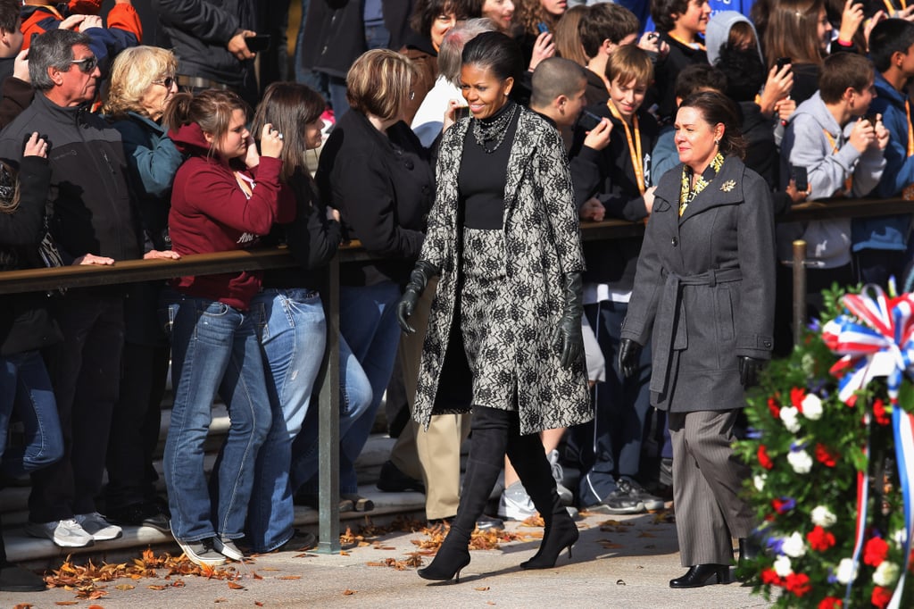 Michelle looked ultrachic in a black-and-gray printed coat and skirt on a cold DC day. She added knee-high black boots to finish off the look.
Michelle looked ultrachic in a black-and-gray printed coat and skirt on a cold DC day. She added knee-high black boots to finish off the look.