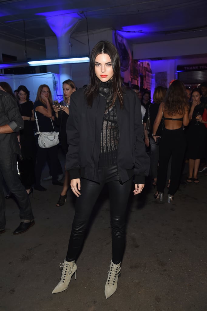 At the Givenchy afterparty, Kendall ditched her runway look for an edgy ensemble that included slick black bottoms, a sheer top, and pointed booties.
