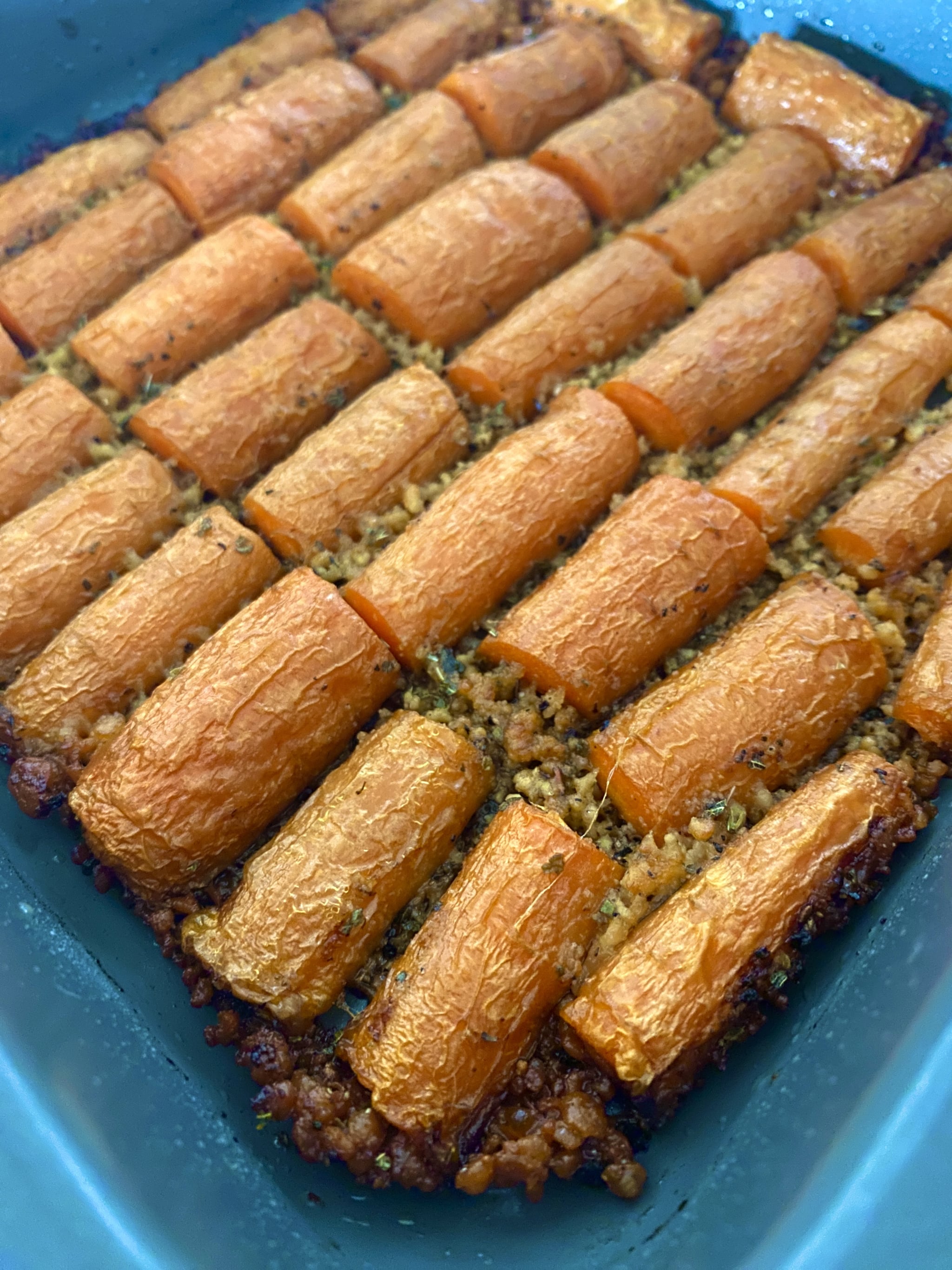 close up of crispy parmesan roasted carrots recipe finished in pan