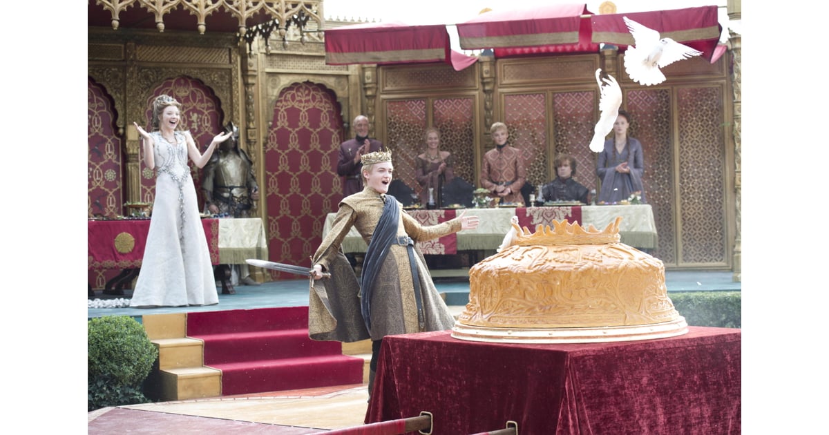A giant pie filled with pigeons greets the newlyweds. Joffrey and
