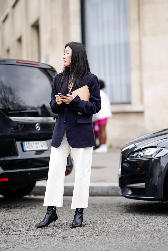 Don't overlook the basics: a navy blazer and black boots ground a cropped white pair.
