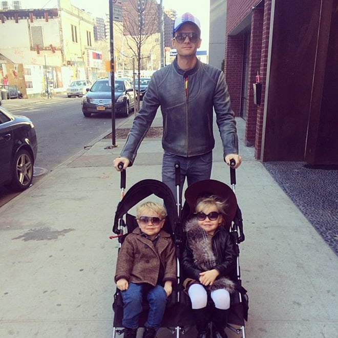 During a stroll through NYC, David Burtka snapped a shot of Neil Patrick Harris and their twins, Gideon and Harper. 
Source: Instagram user burtka