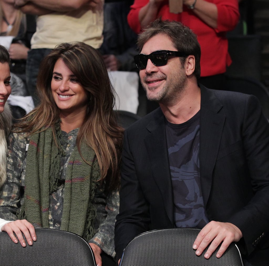 In December 2010, Penélope and Javier shared smiles during a Lakers game in LA.