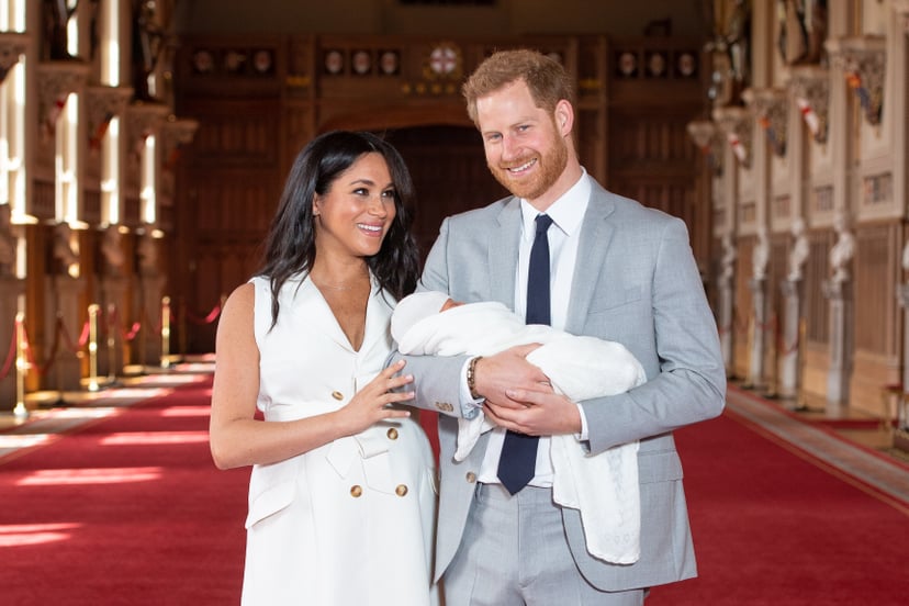 WINDSOR, ENGLAND - MAY 08: Prince Harry, Duke of Sussex and Meghan, Duchess of Sussex, pose with their newborn son during a photocall in St George's Hall at Windsor Castle on May 8, 2019 in Windsor, England. The Duchess of Sussex gave birth at 05:26 on Mo