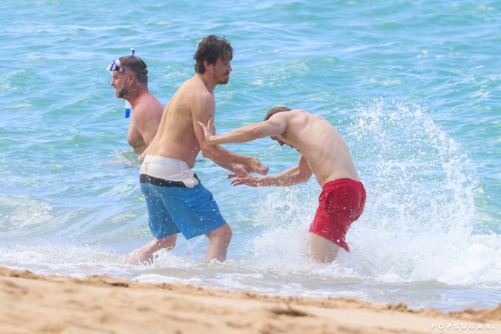 Charlie Hunnam and Garrett Hedlund Wrestle in Hawaii Photos