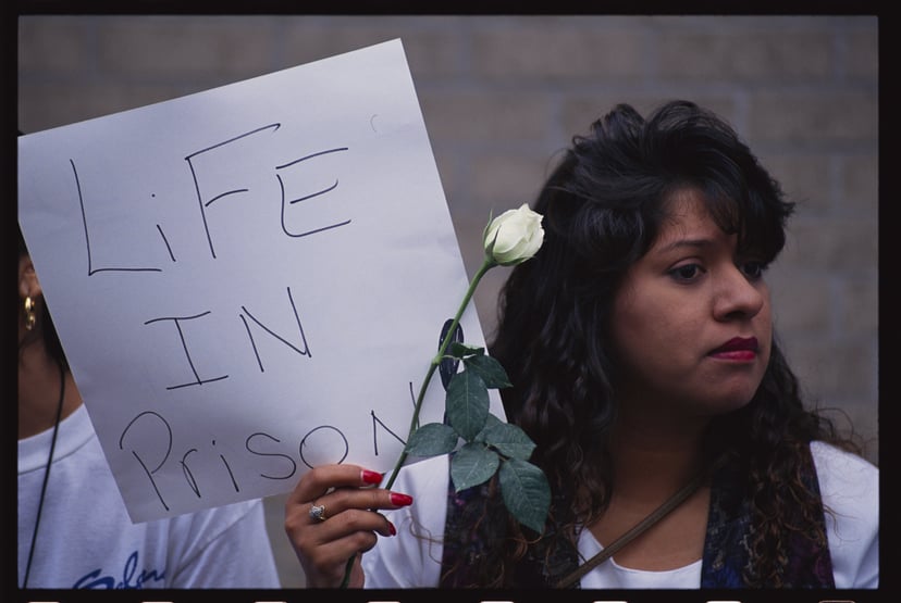 A Selena fan holds a sign outside the courthouse in Houston, Texas where the slain singer's murder trail is being heard. (Photo by © Greg Smith/CORBIS/Corbis via Getty Images)