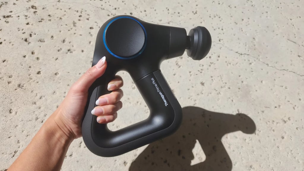 TheraGun Therabody Prime Plus ($220, originally $320)
If your muscles are begging for a little extra TLC, the Theragun massage gun with heat might just be your next recovery obsession. It combines percussion therapy with three heat levels to help ease soreness, loosen tight muscles, and speed up recovery after a tough workout (or a long day hunched over your laptop). The smart, ergonomic design makes it easy to reach your back, shoulders, and legs, and you can fine-tune every session with five speeds and three heat settings. It even pairs with the Therabody app for guided routines and comes with multiple attachments so you can target exactly what hurts. One of our former fitness writers, who also happened to be a strength and conditioning coach, put it to the test. Read her full Theragun Prime Plus review for more details.
Editor Quote: "One of my favorite aspects of the Therabody Theragun Prime Plus is the fact that it can administer heat. It seems like a small thing, but using a massage gun that's cold against the skin isn't always the most comfortable experience. I liked the warmer temperature option, especially when using the Theragun to warm-up or to ease post-workout pain." — Jade Esmeralda, former fitness staff writer