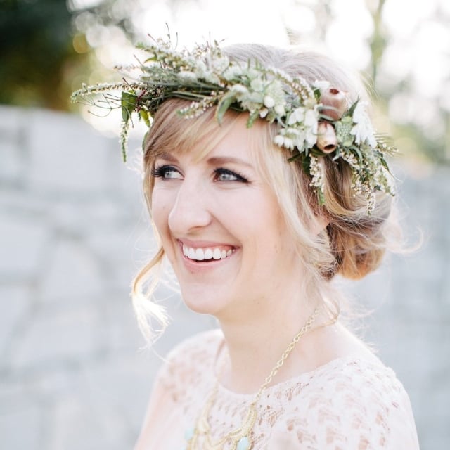 When it's time to order flowers for your wedding, don't forget to snag petals for your hair. Whether you stick a few buds in your updo or crown yourself with a floral wreath, the looks featured here by POPSUGAR Beauty are ideal for a botanical-themed ceremony or Summer garden party.
Photo by Jen Dillender Photography via Style Me Pretty