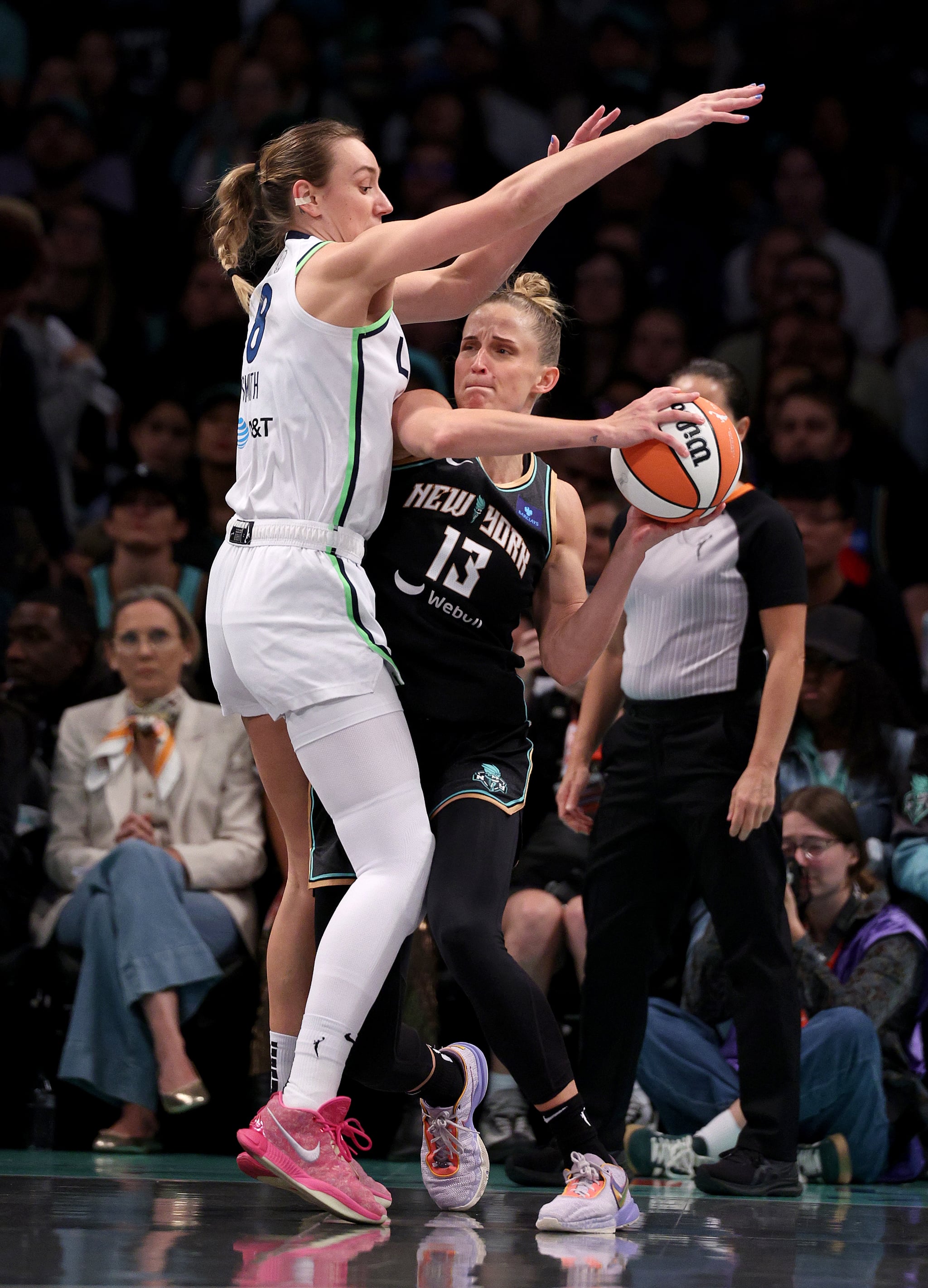 NEW YORK, NEW YORK - OCTOBER 20: Leonie Fiebich #13 of the New York Liberty looks to pass as Alanna Smith #8 of the Minnesota Lynx defends during Game Five of the WNBA Finals at Barclays Center on October 20, 2024 in the Brooklyn borough of New York City. The New York Liberty defeated the Minnesota Lynx 67-62 in overtime to win the championship. NOTE TO USER: User expressly acknowledges and agrees that, by downloading and or using this photograph, User is consenting to the terms and conditions of the Getty Images License Agreement. (Photo by Elsa/Getty Images)