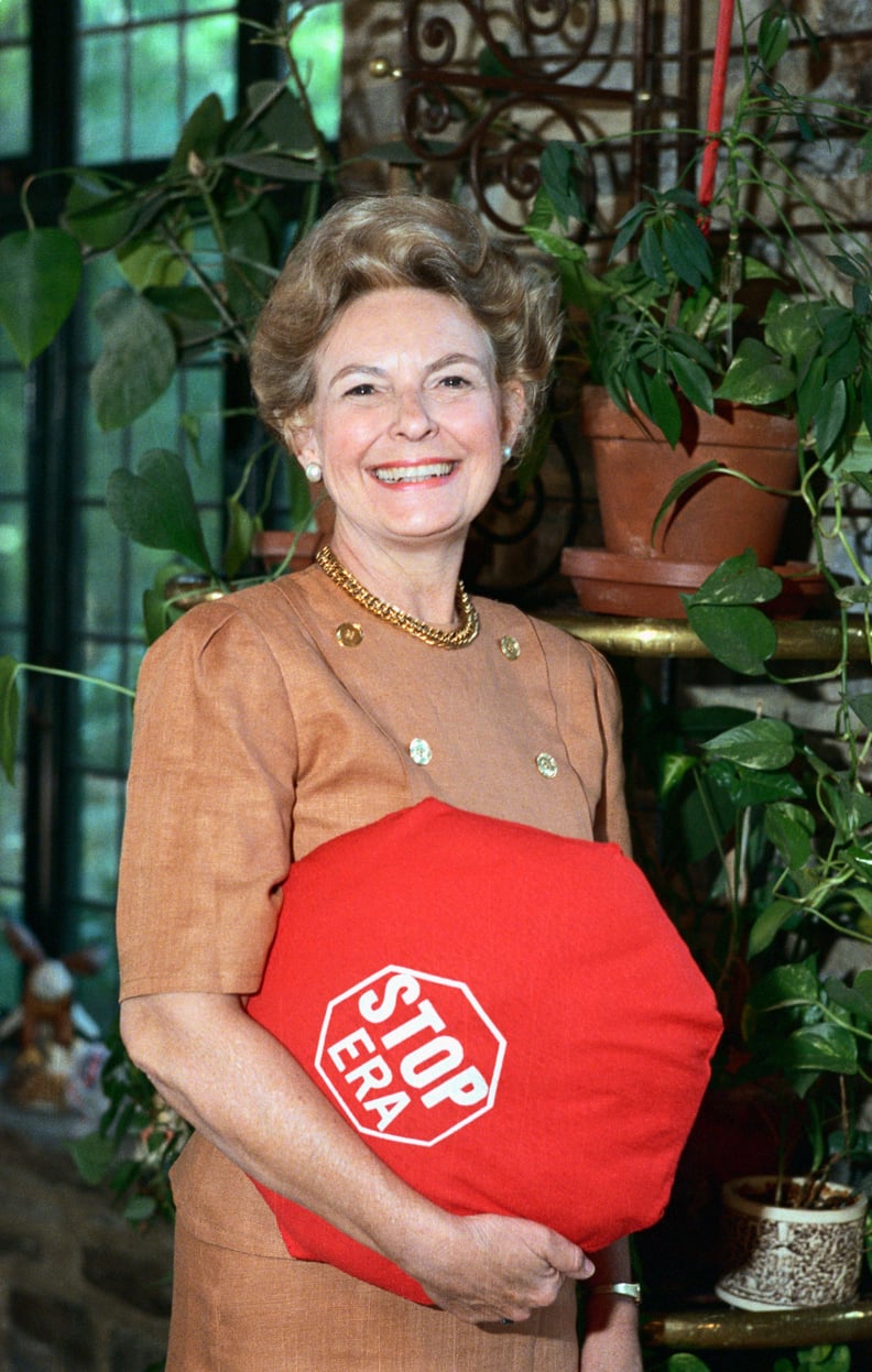 (Original Caption) Alton, Ill.: Phyllis Schlafly, seen at home holding a pillow saying 
