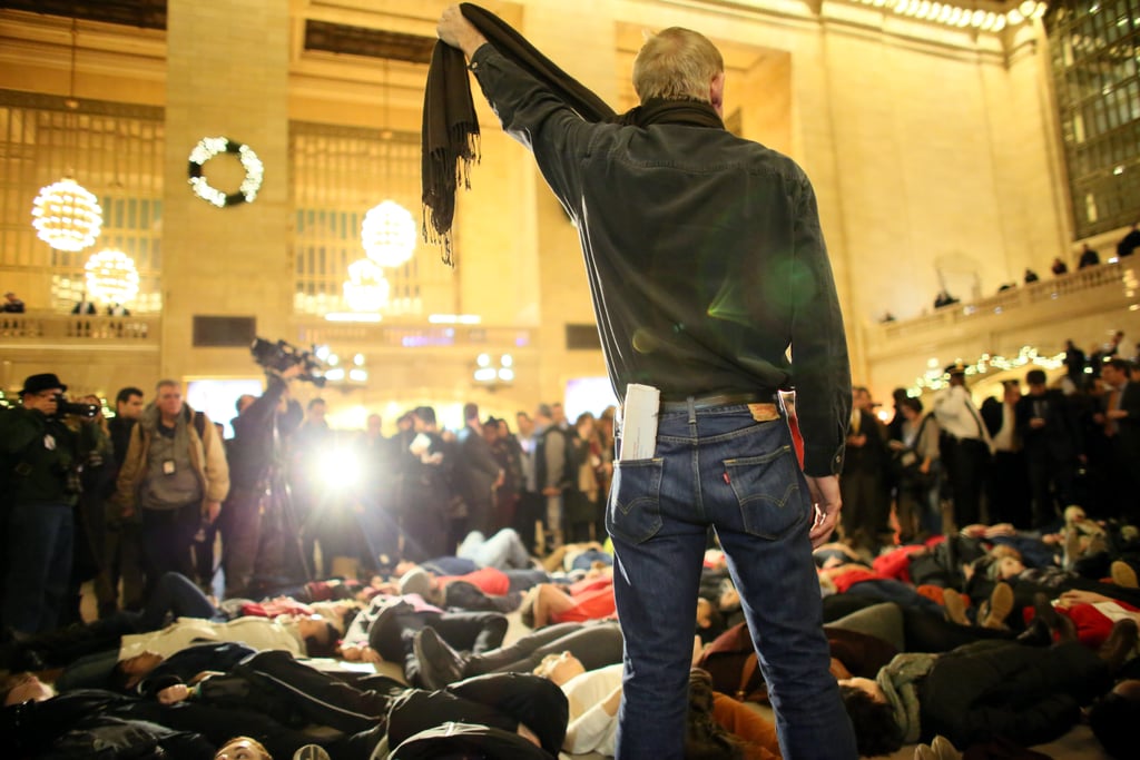 After a grand jury in NYC decided not to indict the police officer who put Eric Garner in a chokehold, a man symbolically choked himself with a scarf during a protest in Grand Central Terminal.