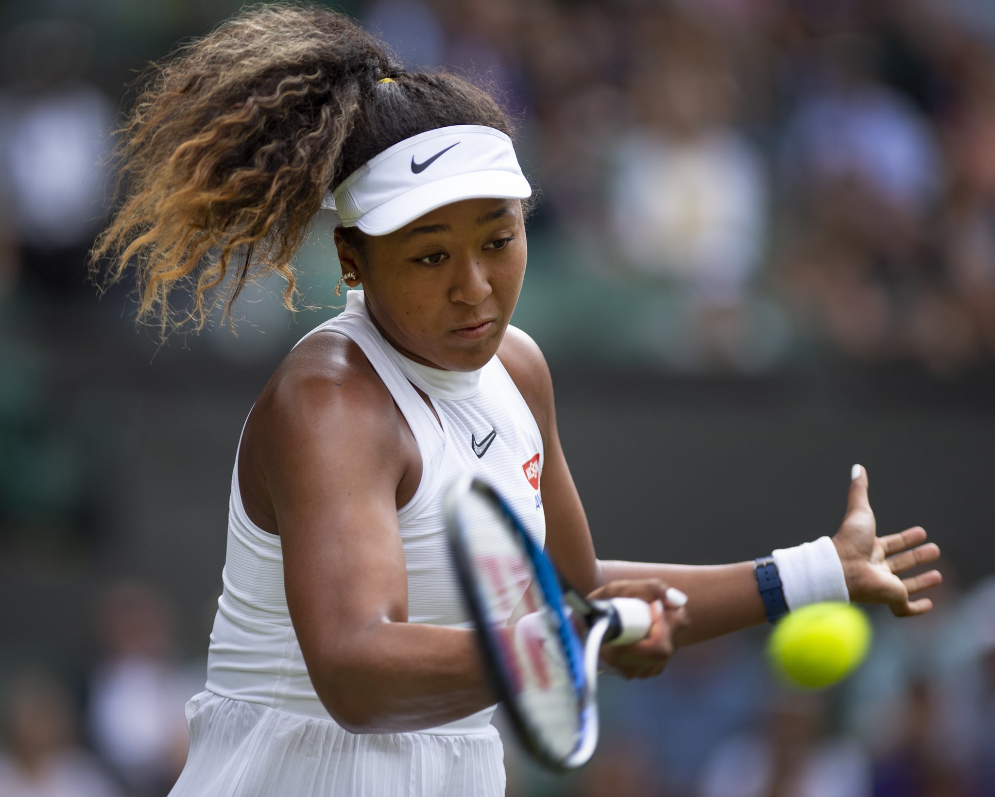 LONDON, ENGLAND - JULY 01: Naomi Osaka of Japan in action during Day One of The Championships - Wimbledon 2019 at All England Lawn Tennis and Croquet Club on July 1, 2019 in London, England. (Photo by Visionhaus/Getty Images)