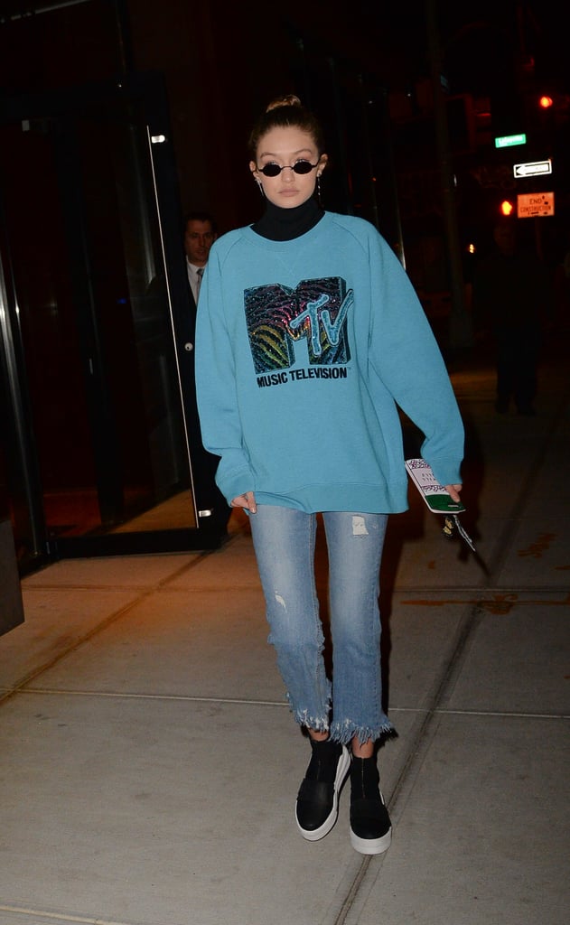 Gigi's MTV sweatshirt by Marc Jacobs took us way back — especially when you add in those tiny '90s style shades.  
