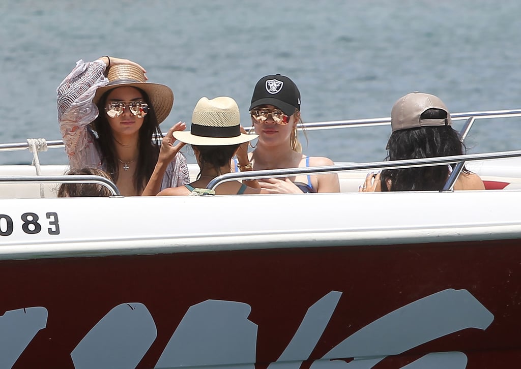 Hats were a must have for the Kardashian-Jenner sisters as they boarded a boat to go parasailing.