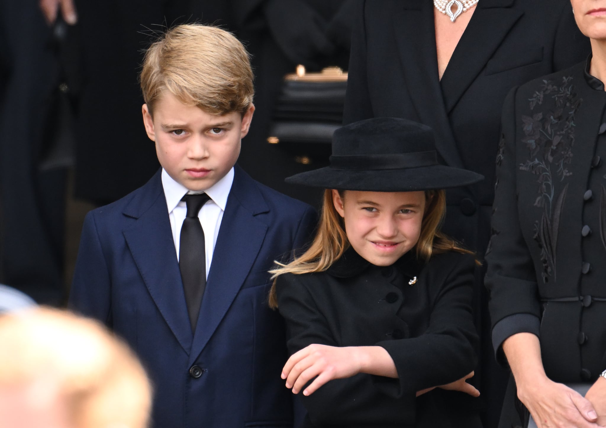 LONDON, ENGLAND - SEPTEMBER 19: Prince George of Wales and Princess Charlotte of Wales during the State Funeral of Queen Elizabeth II at Westminster Abbey on September 19, 2022 in London, England. Elizabeth Alexandra Mary Windsor was born in Bruton Street, Mayfair, London on 21 April 1926. She married Prince Philip in 1947 and ascended the throne of the United Kingdom and Commonwealth on 6 February 1952 after the death of her Father, King George VI. Queen Elizabeth II died at Balmoral Castle in Scotland on September 8, 2022, and is succeeded by her eldest son, King Charles III. (Photo by Karwai Tang/WireImage)