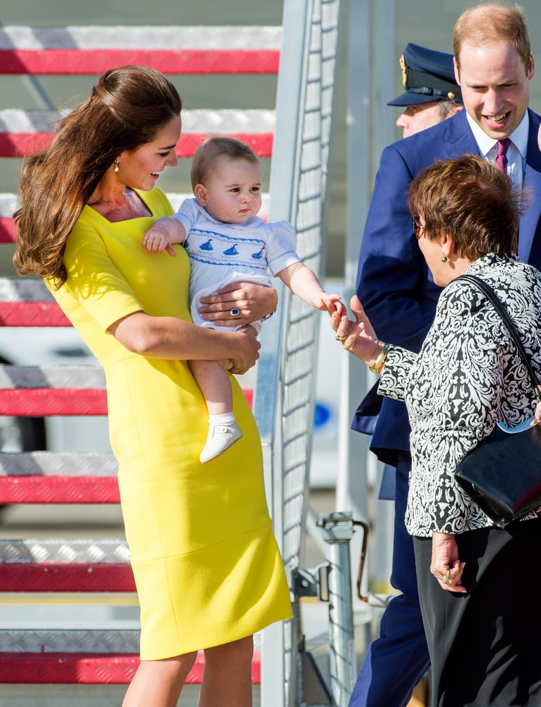 Kate Middleton held Prince George in her arms after the royals landed in Australia on Wednesday.