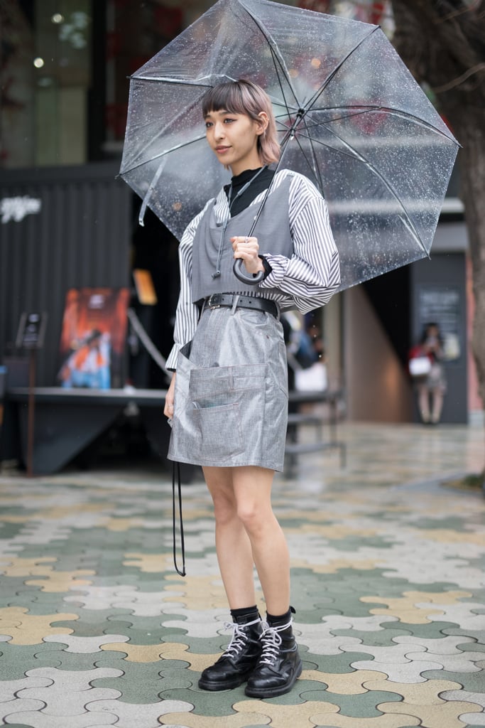 A guest styling a silver minidress with a gray vest during Fashion Week in Tokyo.