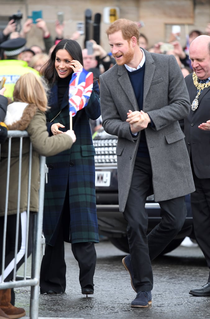 When in Edinburgh, he wore a grey coat, a navy jumper, a white shirt, and black trousers.