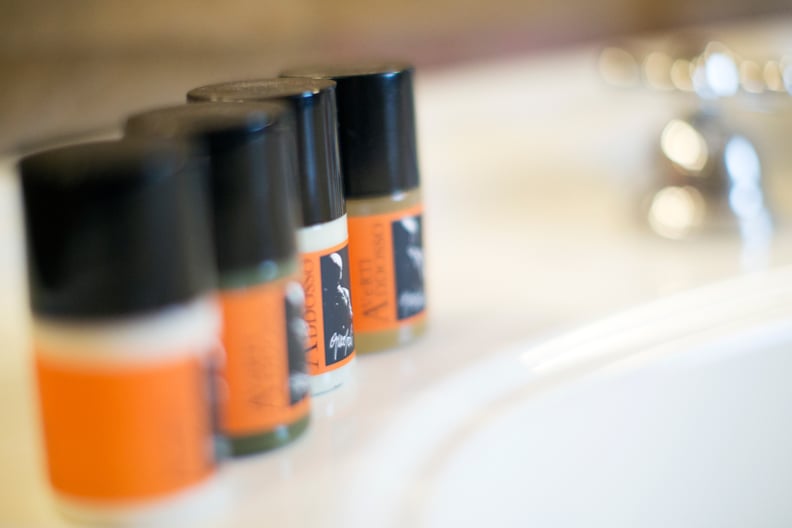 Stashing all the shampoo, conditioner, and bars of soap possible to bring back with you.