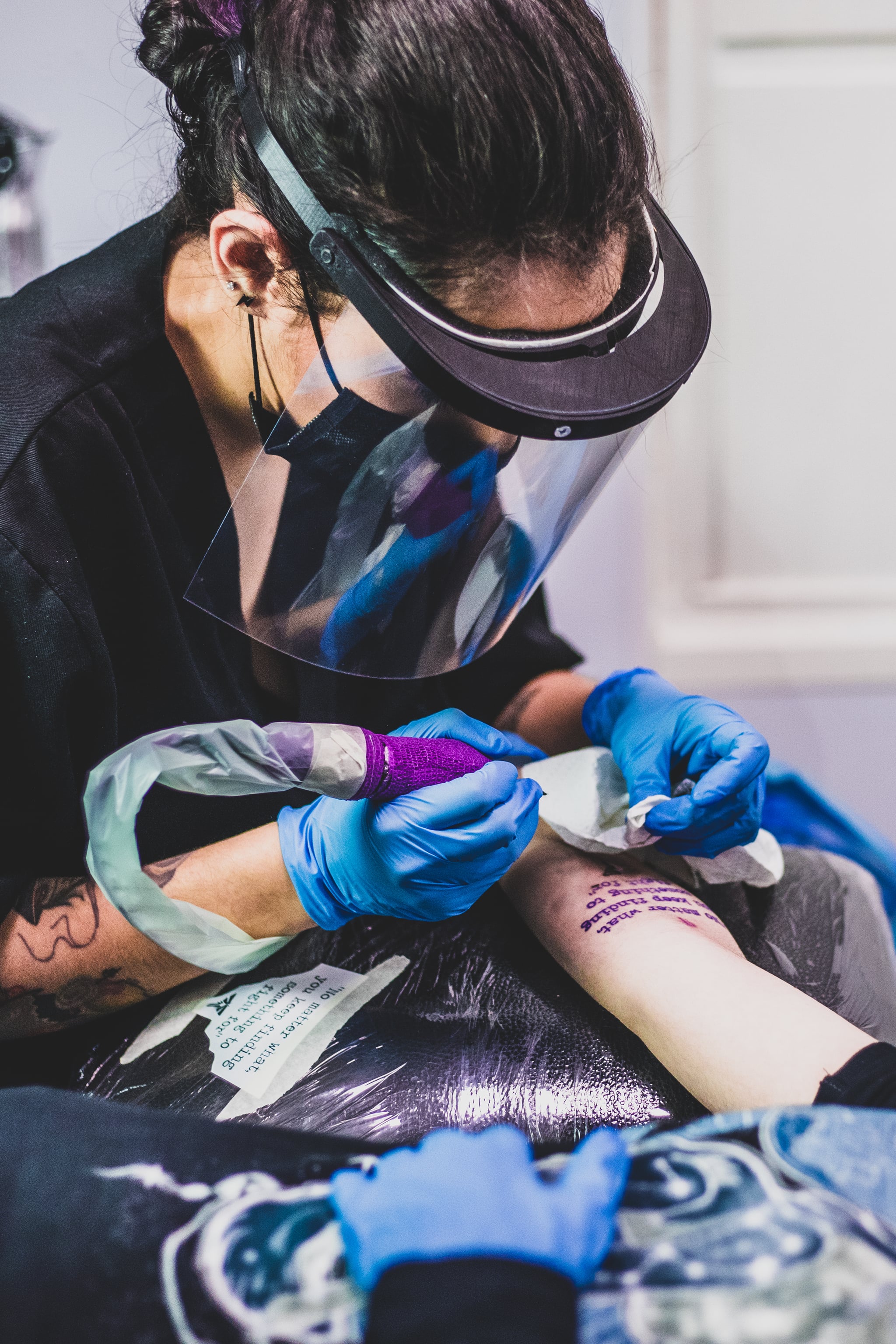 MADRID, SPAIN - MAY 13: The female tattoo artist, Eani 13, is seen making a tattoo on an arm of a woman on May 13, 2020 in Madrid, Spain. Eani 13 makes vegan tattoos at Ink Sweet Tattoo located in Madrid (Spain). The studio reopens after the lockdown due to coronavirus with preventive measures.  (Photo by Aldara Zarraoa/Getty Images)