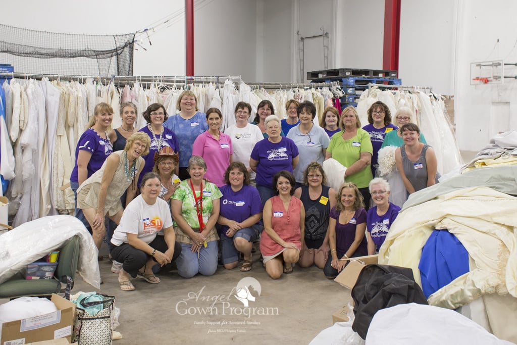 Volunteers work to organize donated gowns, which will soon be crafted into bereavement garments.