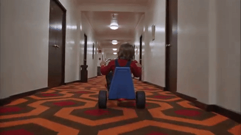 Danny Riding His Bike Down the Hallway (With That Carpet)