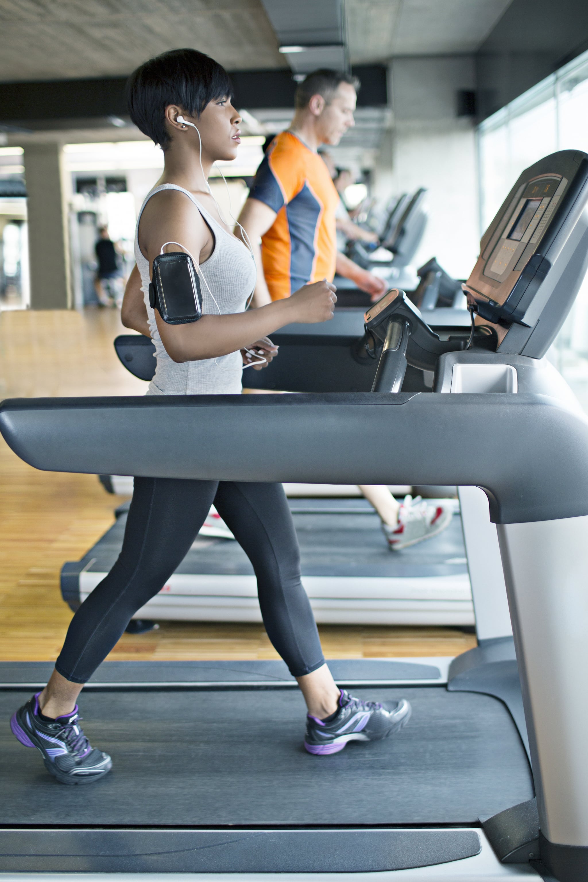 People walking on treadmill.