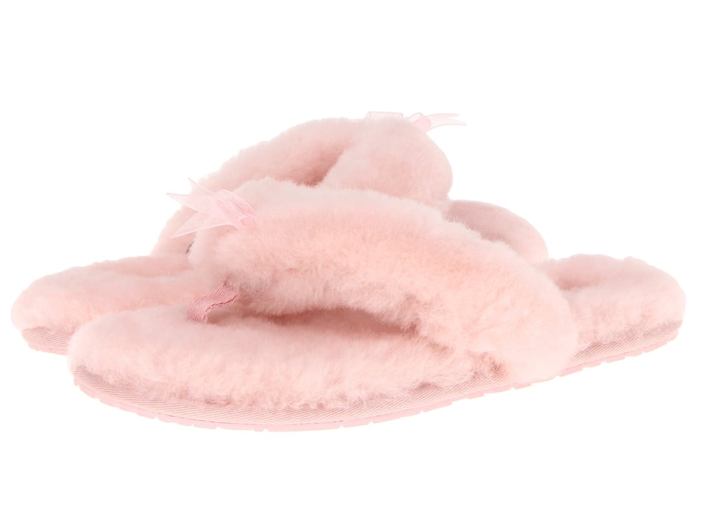 "Slippers are a perfect functional gift for anyone. These are my favorite because they are so soft and pretty! I keep a couple pairs for myself and am always wearing them. They are a great gift for your mommy or your bestie who just needs to kick her feet up."  
Ugg Fluff Flip Flop II ($89)
