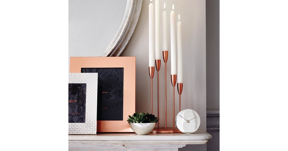 Hyggefy your mantel with candles, mementos, and greenery How to