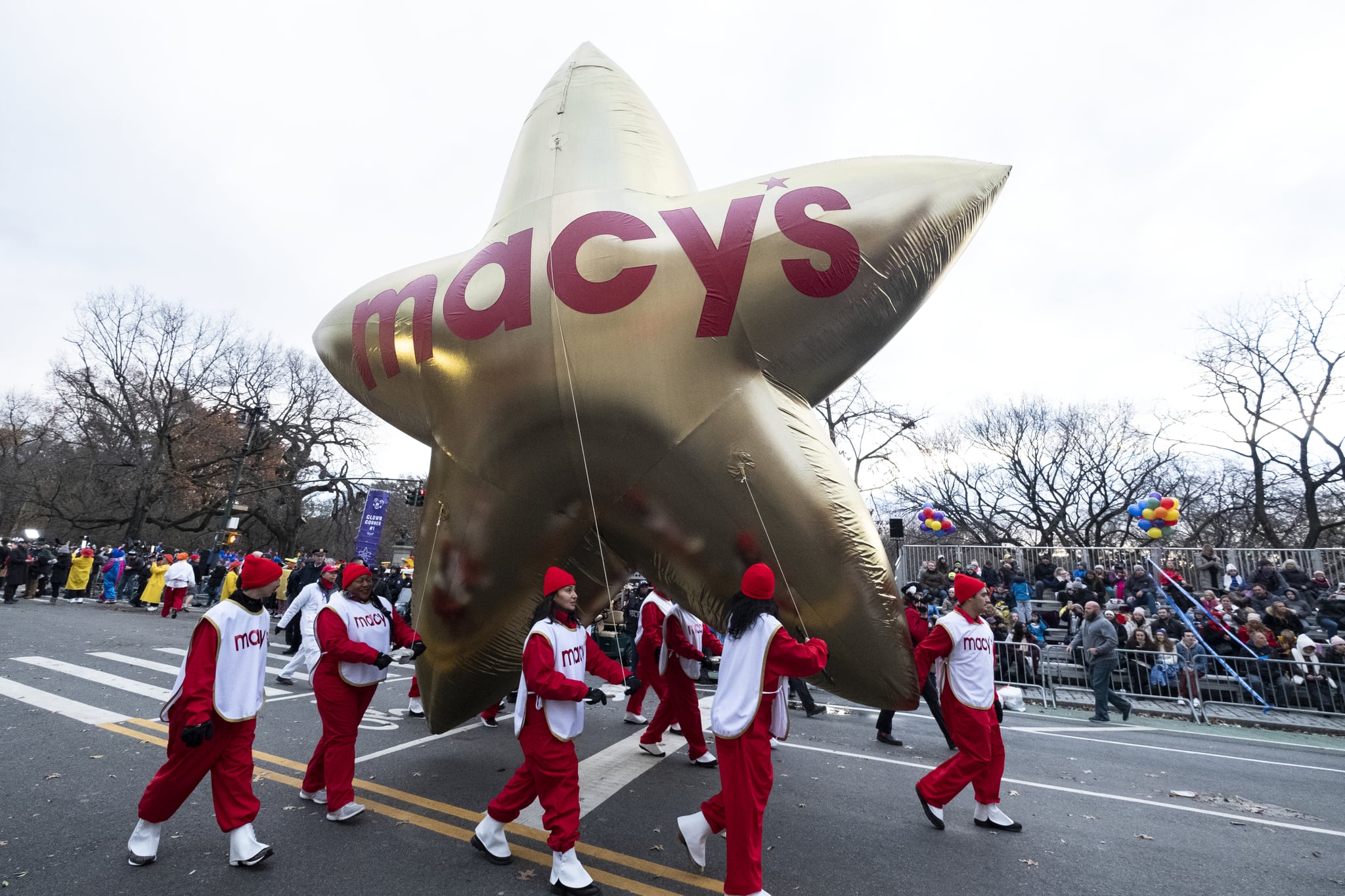 MANHATTAN, NY - NOVEMBER 28: Balloon handlers fight the strong wind gusts and bring out Opening Macy's Stars down Central Park West during the 93rd Annual Macy's Thanksgiving Day Parade.  The parade marched down from 77th & Central Park West south and ended at 34th Street-Macy's Herald Square was held in the Manhattan borough of New York on November 28, 2019, USA.  (Photo by Ira L. Black/Corbis via Getty Images)