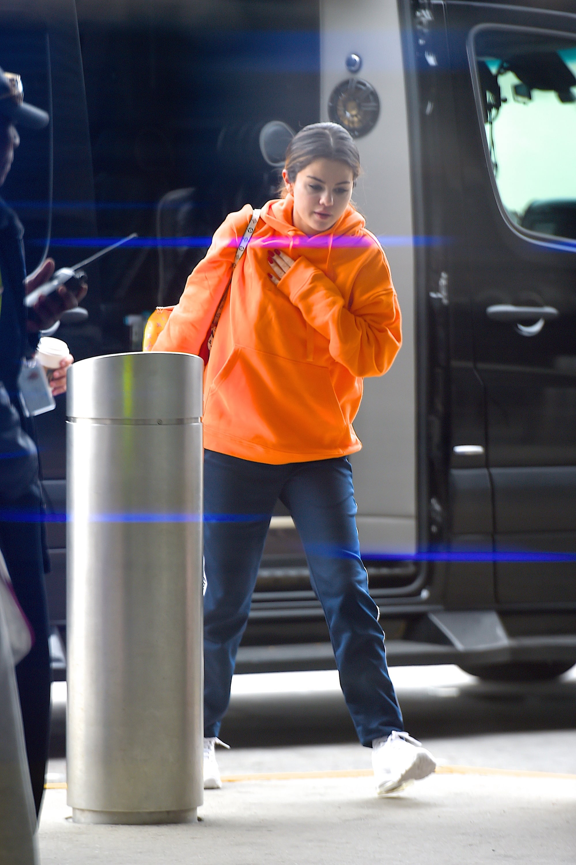 Selena Gomez's Louis Vuitton Bag and Sneakers at the Airport