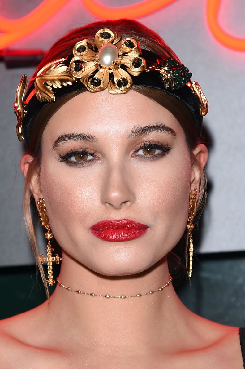 The Model Paired Her Dress With Gold Accessories, Including an Embellished Headband