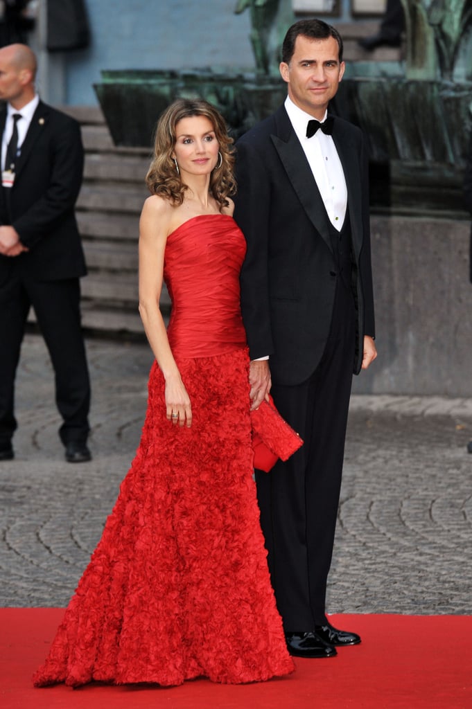 A Strapless Red Cross-Body and Floral Gown