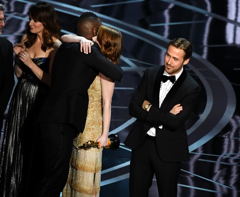 HOLLYWOOD, CA - FEBRUARY 26:  'Moonlight' actor Mahershala Ali hugs Emma Stone after it was discovered 'La La Land' was mistakenly announced as Best Picture onstage during the 89th Annual Academy Awards at Hollywood & Highland Center on February 26, 2017 