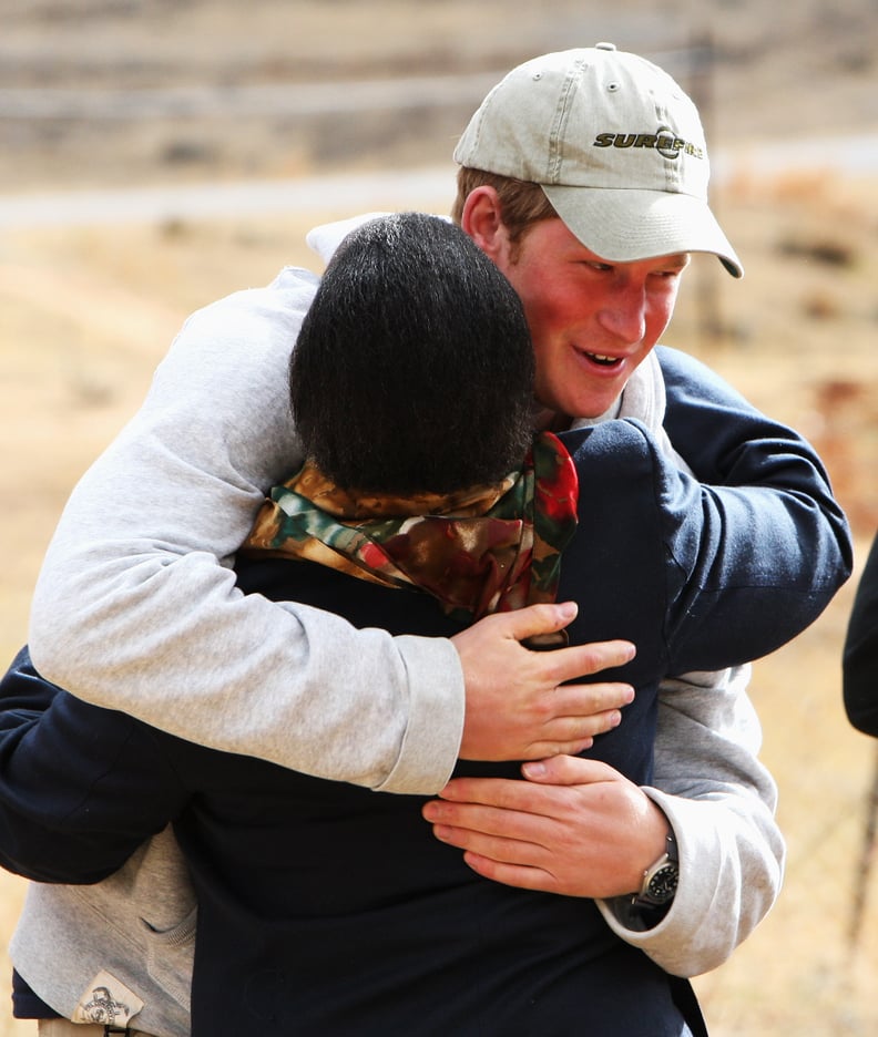 Harry embraced a staff member at the Lesotho Child Counseling Unit in 2008.